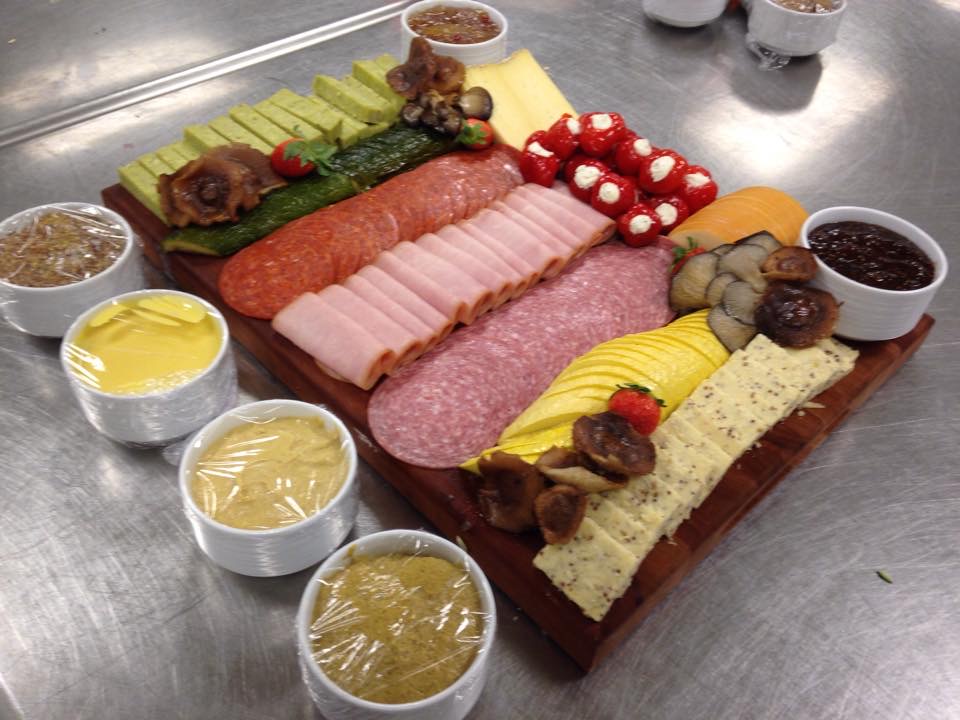 Charcuterie and cheese board with artisan dips and cured meats