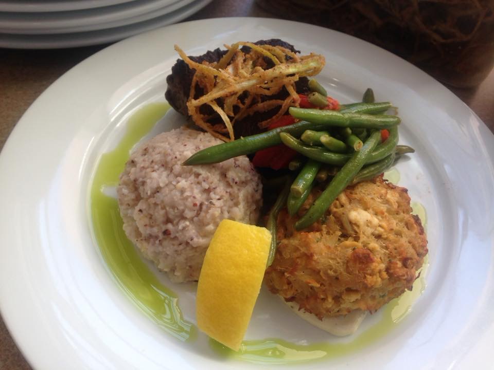 Maryland-style jumbo lump crab cake with green beans and grits